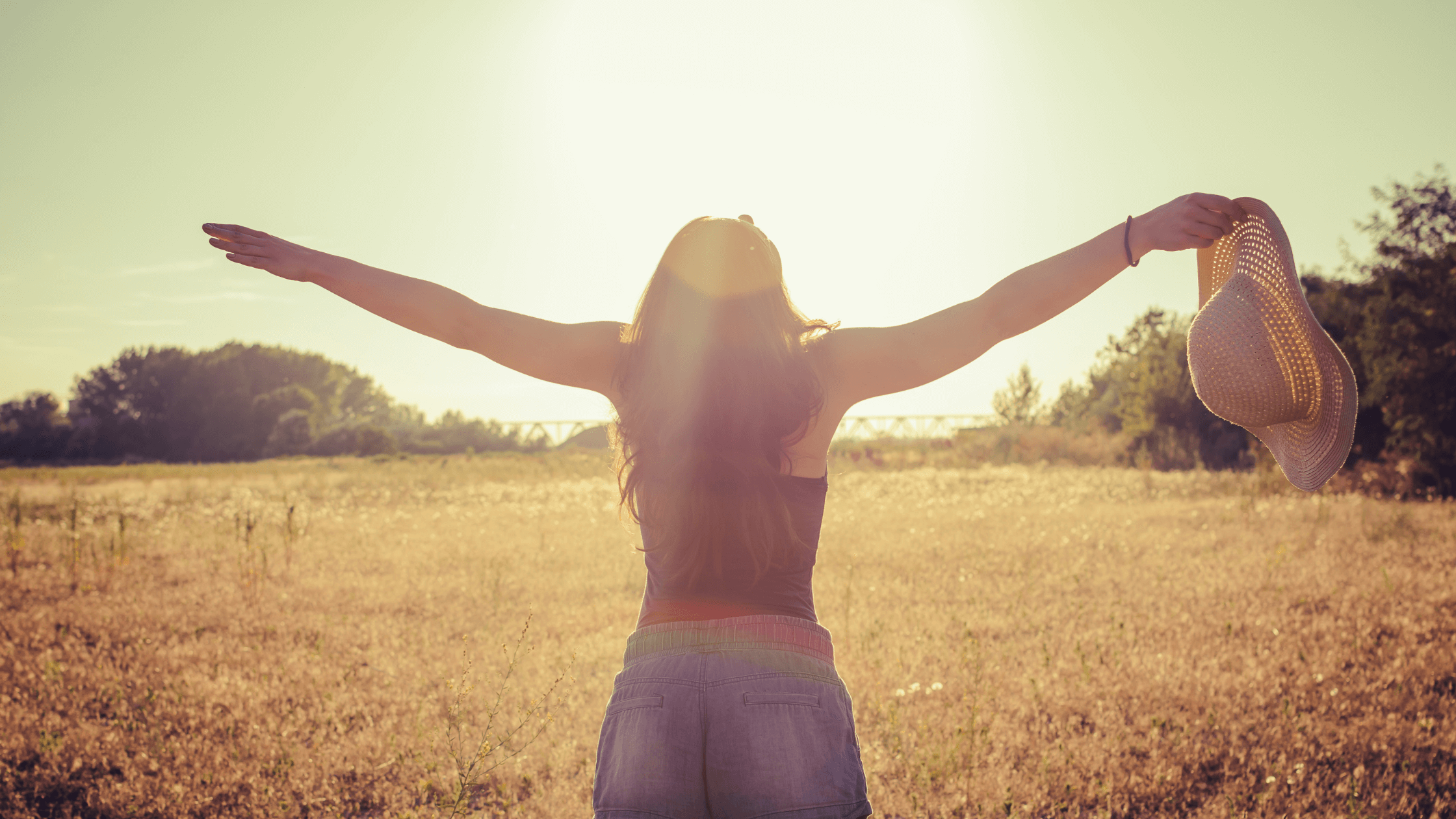 lady with arms raised-how to be present in the moment