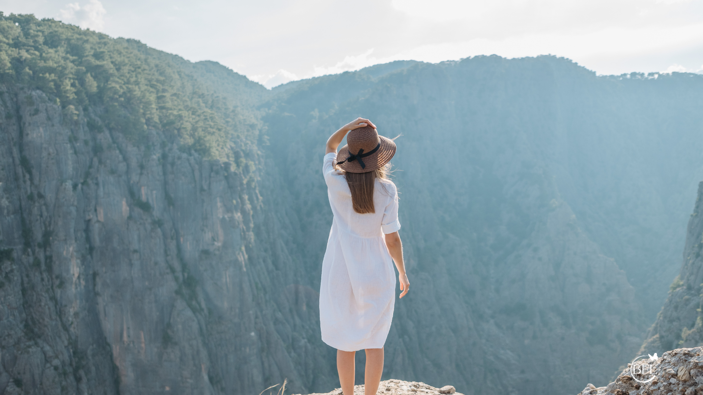 lady on mountain-spiritual meaning of perseverance